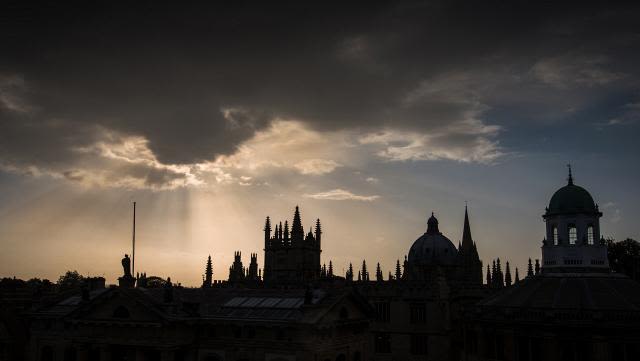 Silhouette of oxford spires at dusk.