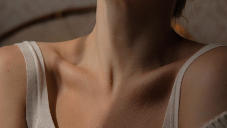 Stock image of a woman's bare throat.